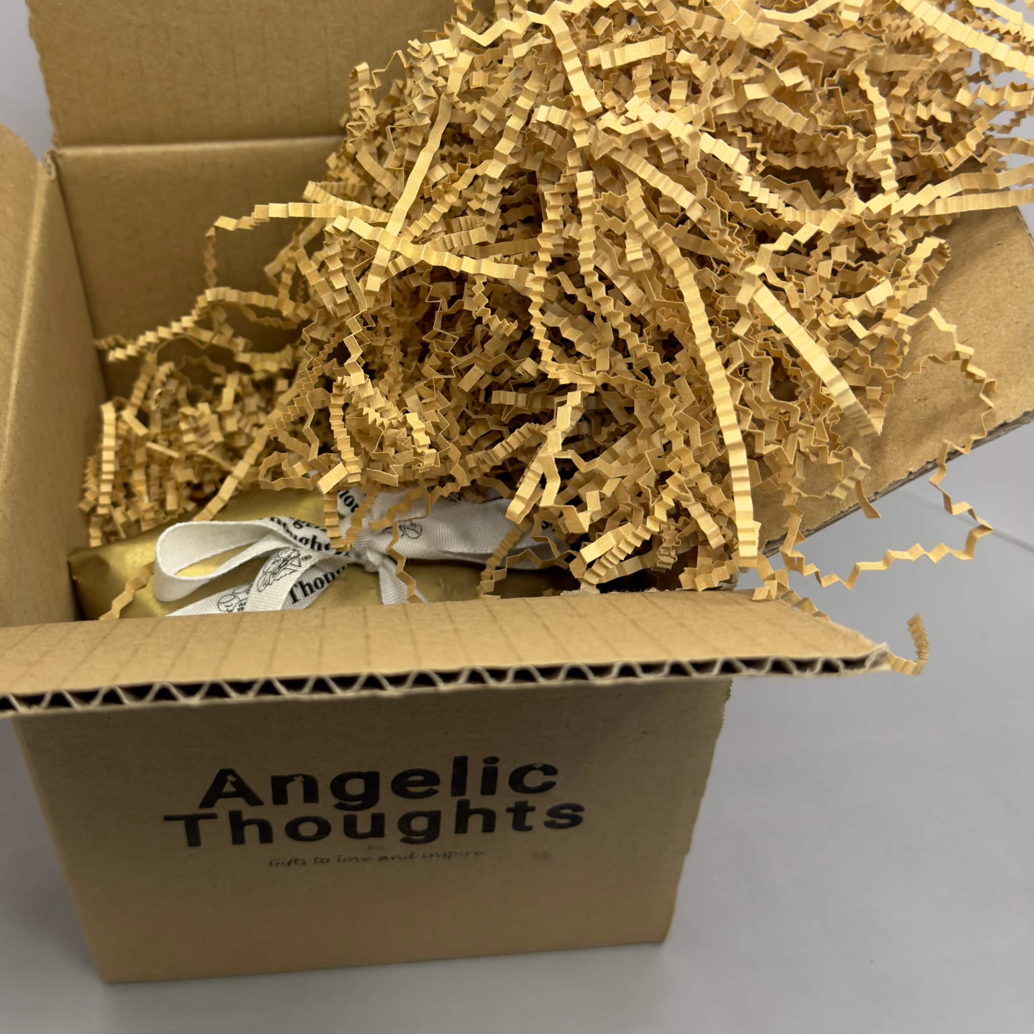 open angelic thoughts box with wrapped tealight 2 pack and shreded paper