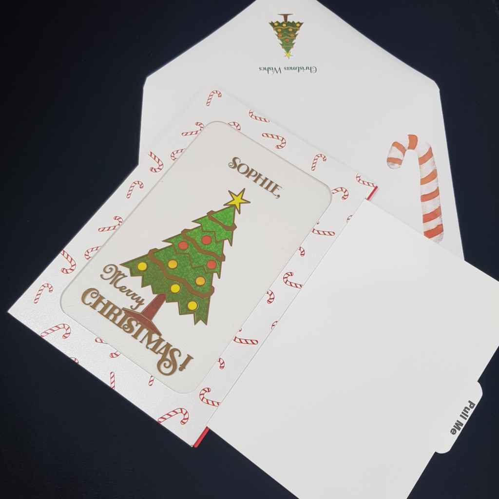 Merry Christmas Card with coloured Christmas tree and red and white candy canes. Envelope with Christmas wished text and candy cane and tree.