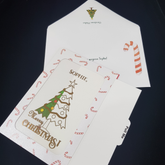 Slider Christmas greeting card. Merry Christmas text. Envelope with red and white candy cane and Christmas tree.