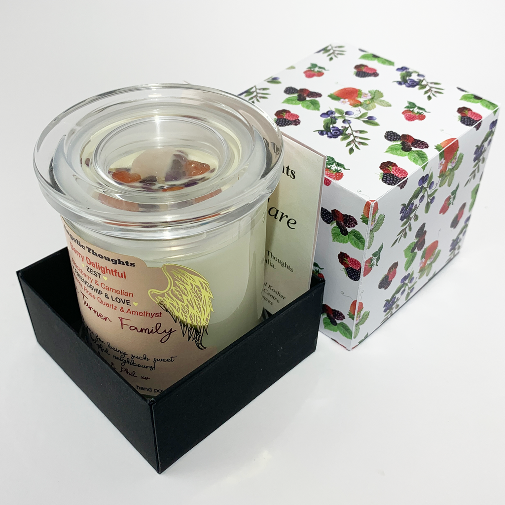 Personalised Berry Delightful candle in box base with part of candle care card visible and the box lid behind