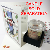 This image shows the card upright, slightly open, allowing you to see the way the elements are raised out from the card surface. There is also an image of the matching "Berry Delightful" candle in a black box base with the partial view of the side of the box top, which is white with berries printed randomly on it. The words "Candle Sold Separately" are printed in red.
