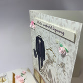 Close up - custom stippled wedding card, handmade roses, pearls and raised sentiments