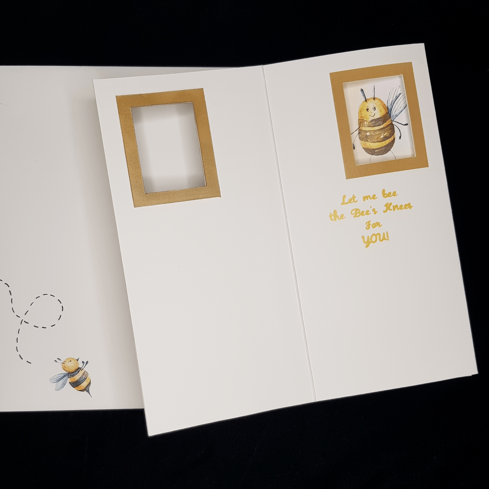 open Honey Bee card with message lying on front of envelope